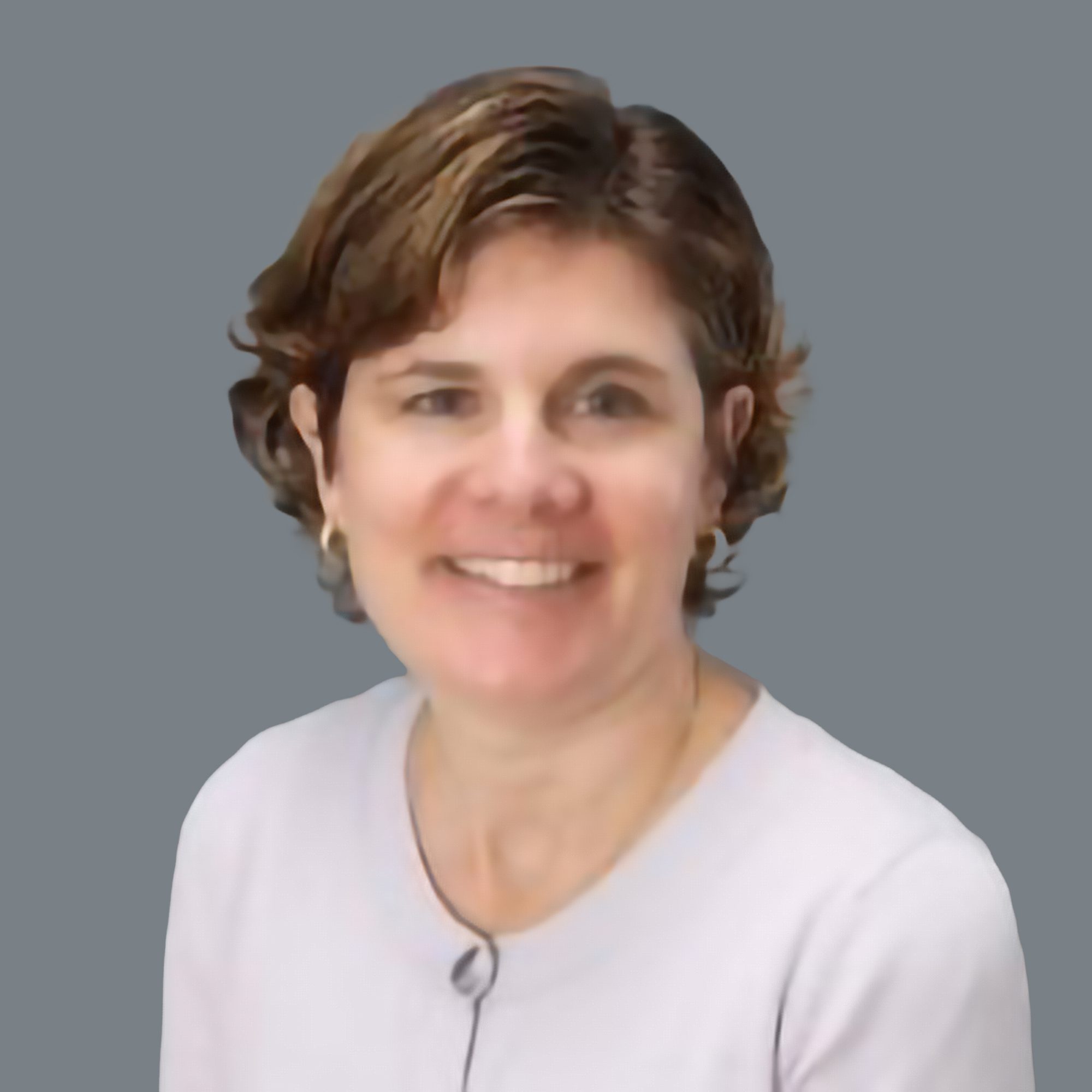 Smiling woman with short brown hair wearing a light sweater. Relevant for introducing a professional or personal profile.