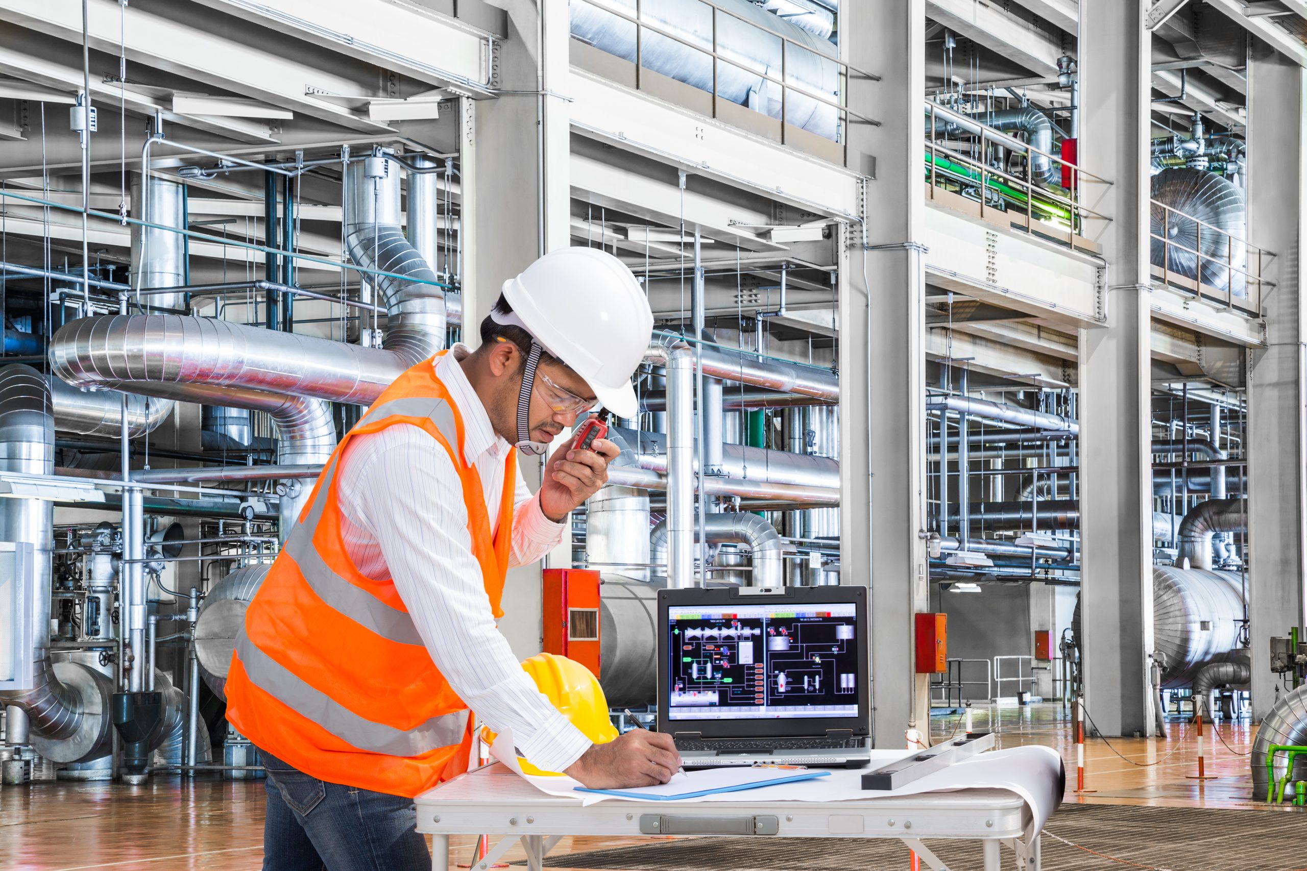 Electrical engineer working at control room of a modern thermal power plant